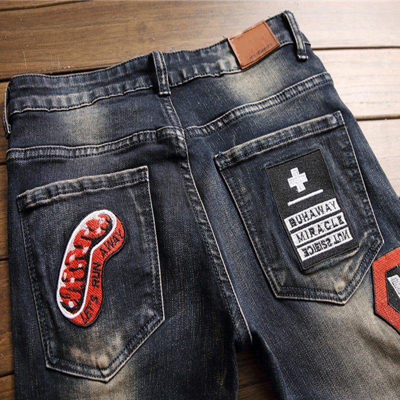 Men’s Distressed Jeans with Badge Detail